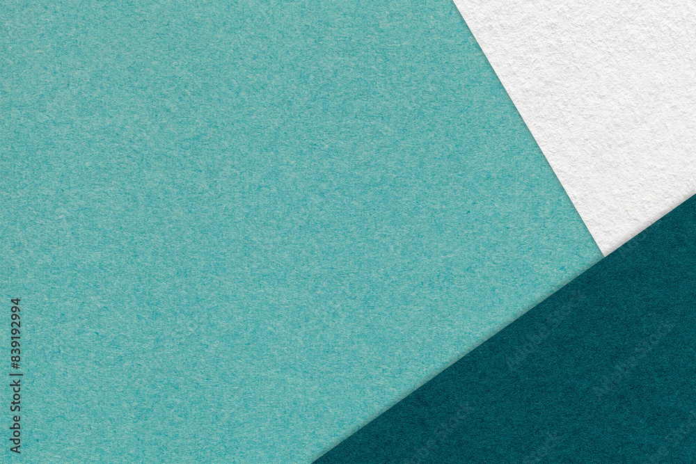 Texture of craft cyan color paper background with white and emerald border. Vintage abstract teal cardboard. Texture of craft cyan color paper background with white and emerald border. Vintage abstract teal cardboard.