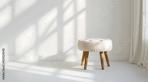 An elegant upholstered stool isolated on a pristine white surface. photo