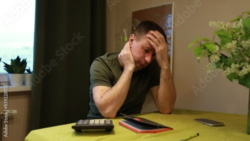 Frustrated Man Dealing With Financial Stress at Home During Evening