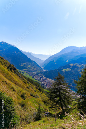 Scenic view of mountain village Airolo with Leventina Valley in the Swiss Alps on a sunny late summer day. Photo taken September 10th, 2023, Gotthard, Canton Ticino, Switzerland. photo