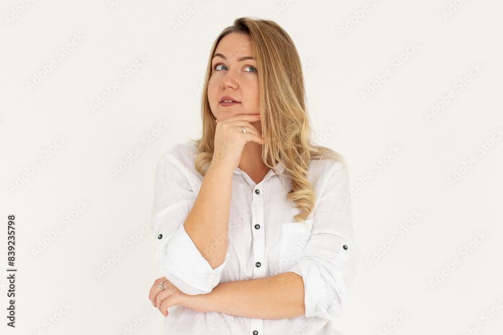 Closeup photo of amazing lady looking up empty space deep thinking creative person arm on chin wear white shirt isolated white color background Closeup photo of amazing lady looking up empty space deep thinking creative person arm on chin wear white shirt isolated white color background
