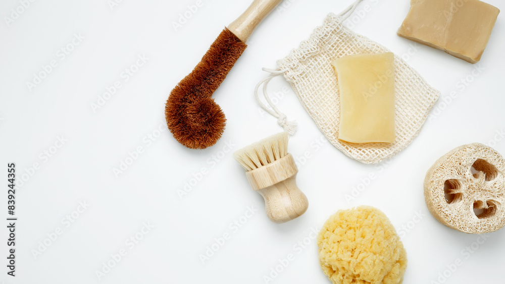 Natural organic eco cosmetics. Soap Eco, reusable cotton pads, loofah natural sponge washcloth, cotton swab, eucalyptus leaves on white background. Flat lay, top view, copy space Natural organic eco cosmetics. Soap Eco, reusable cotton pads, loofah natural sponge washcloth, cotton swab, eucalyptus leaves on white background. Flat lay, top view, copy space