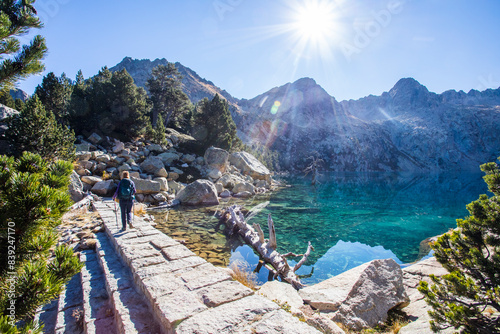 Young hiker woman in autumn in Aiguestortes and Sant Maurici National Park, Spain photo