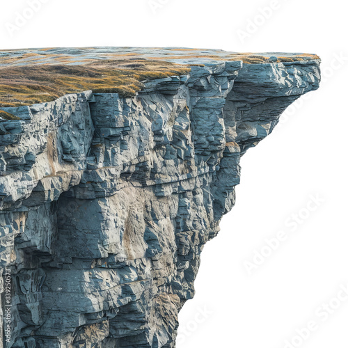 Stunning cliff edge with rugged rock formations and a grassy top, perfect for nature and landscape photography.