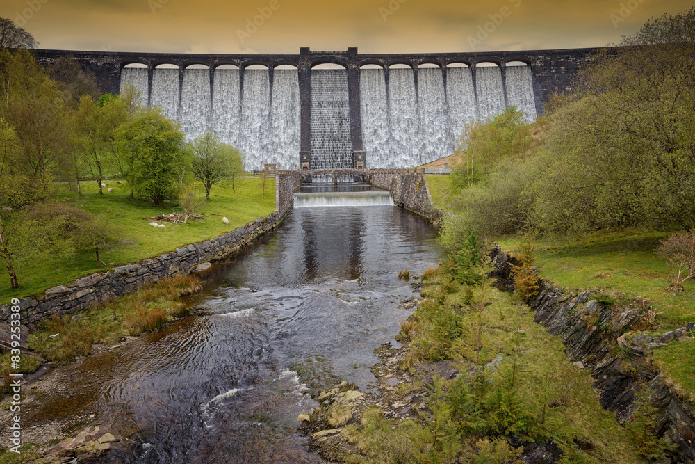 With the reservoir full the water overflows at the Caerwen Dam The Elan Valley Wales UK With the reservoir full the water overflows at the Caerwen Dam The Elan Valley Wales UK