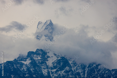 Annapurna South, Mardi Himal and Machapuchare mountain summits snow peaks in Himalayas range, Nepal. Scenic beautiful mountain landscape on the trekking path to Annapurna Basce camp hike photo