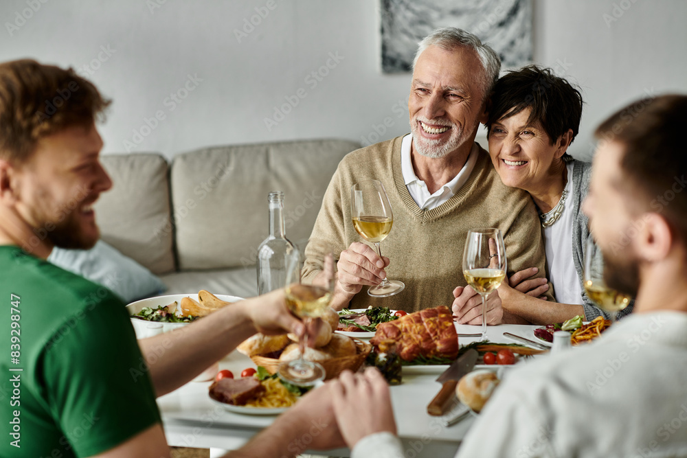 A gay couple enjoys a dinner with their family, sharing a warm and loving moment. A gay couple enjoys a dinner with their family, sharing a warm and loving moment.