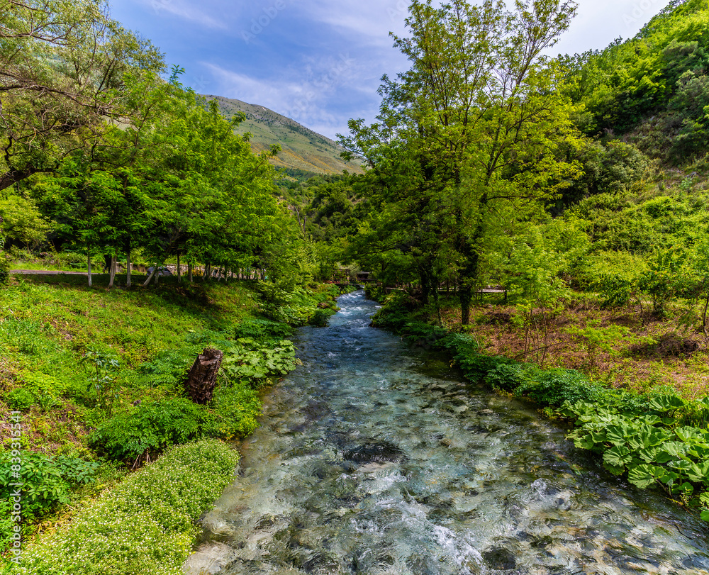 A view up the river leading to the Blue eye spring in Muzine, Albania in summertime A view up the river leading to the Blue eye spring in Muzine, Albania in summertime