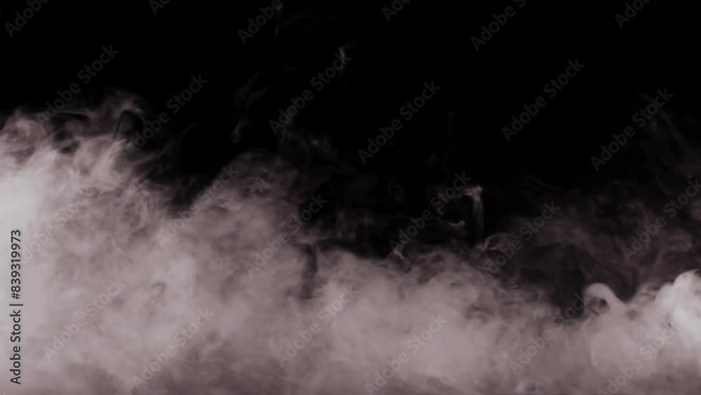 Grey-brown smoke on a black background in motion Grey-brown smoke on a black background in motion
