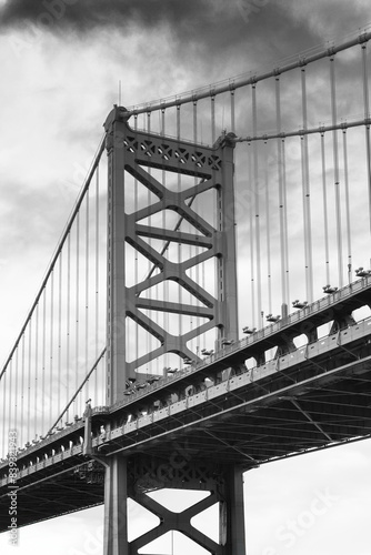 A large suspension bridge with a gray and black color scheme
