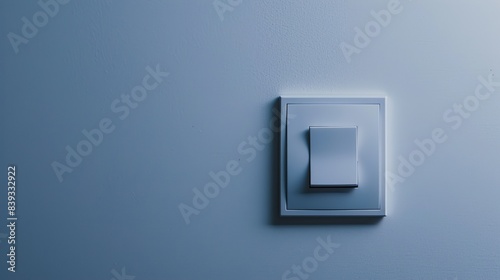 A modern light switch with a sleek design, positioned against a solid white background, showcasing its simplicity and functionality in contemporary interiors.