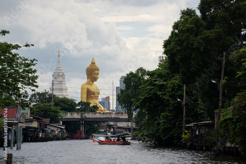 Wat Paknam Bhasicharoen temple big gold buddha statue in Bangkok, Thailand photo