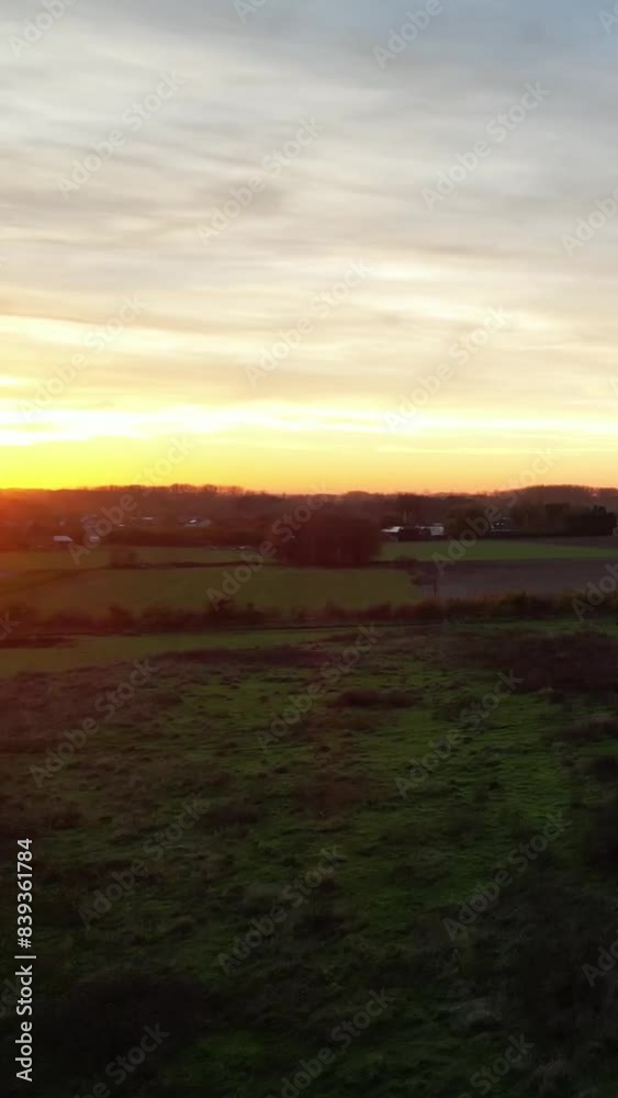 Sunset left to right and upwards aerial revealing the landscape countryside Sunset left to right and upwards aerial revealing the landscape countryside