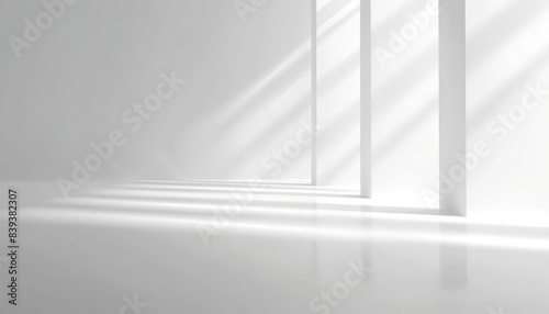 white background with light shades and invisible lines lights and shadow play on white wall of empty room