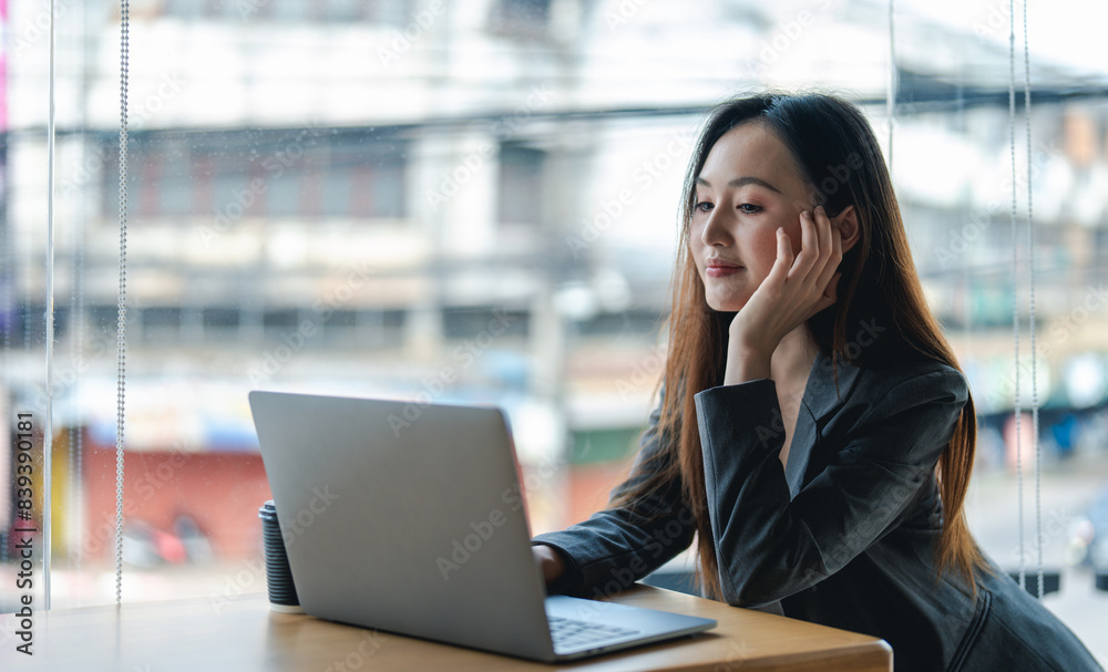 Smiling young asian businesswoman using computer at home office workplace, happy korean employee working on laptop, attractive japanese or chinese woman student studying communicating online with pc Smiling young asian businesswoman using computer at home office workplace, happy korean employee working on laptop, attractive japanese or chinese woman student studying communicating online with pc