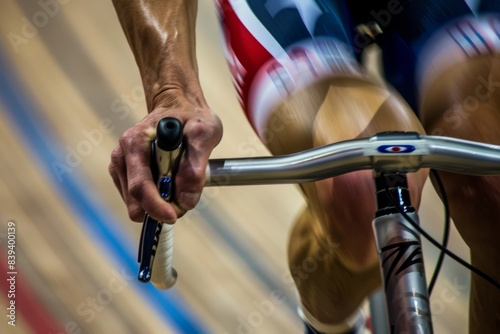 Close-Up of Cyclist's Hand Gripping Handlebars During Intense Olympic Velodrome Race - Athletic Effort and Control