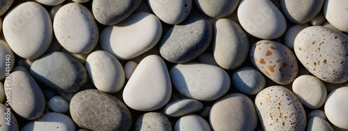 Small pebble arrangement forming a white textured background.