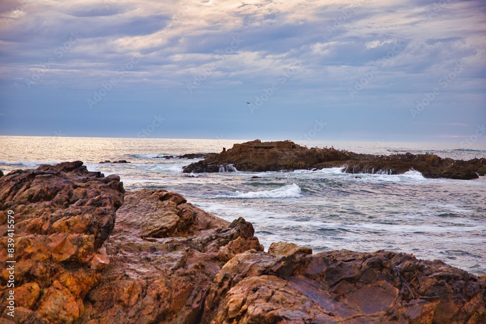 Ocean waves crashing on rocks on a bright day. Seascape with waves and rocks, coast of Portugal Ocean waves crashing on rocks on a bright day. Seascape with waves and rocks, coast of Portugal