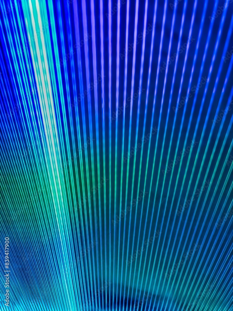 Metal reflection background. The metal roof forms diagonal lines. Textured recycled cardboard toned classic blue. Fractal image of blue concentric ripples for a background Metal reflection background. The metal roof forms diagonal lines. Textured recycled cardboard toned classic blue. Fractal image of blue concentric ripples for a background