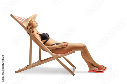 Fotografija Attractive young woman in bikini sunbathing on a beach chair