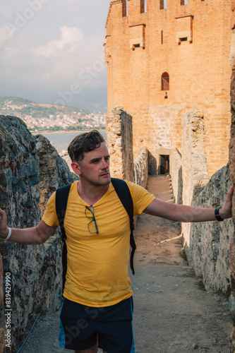 Man at fortress ruins of th...