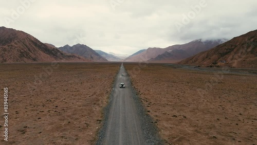 Off-road vehicle driving in Hoh Xil, no-man's land, deserted photo