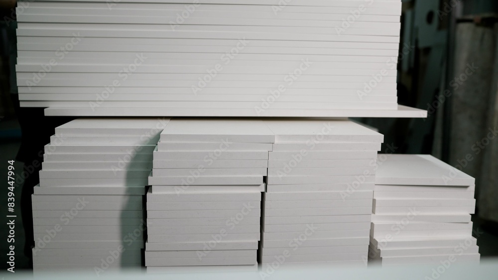 Obraz premium Samples of chipboard and MDF panels for furniture production. Selecting material when ordering furniture. Furniture panels are white, in furniture production.