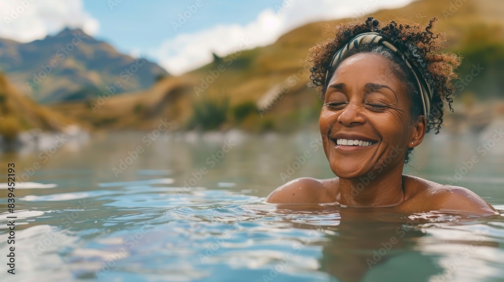 Joyful African American Woman Swimming in Mountain Lake. International Self Care Day