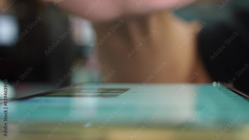Male index finger scrolling and tapping through phone screen messages close up view. Internet and digital lifestyle. Male index finger scrolling and tapping through phone screen messages close up view. Internet and digital lifestyle.