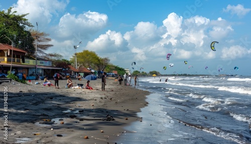 Capturing the Holiday Spirit at Depok Yogyakarta Beach: A Vibrant Scene of Kite Flying and Coconut S photo