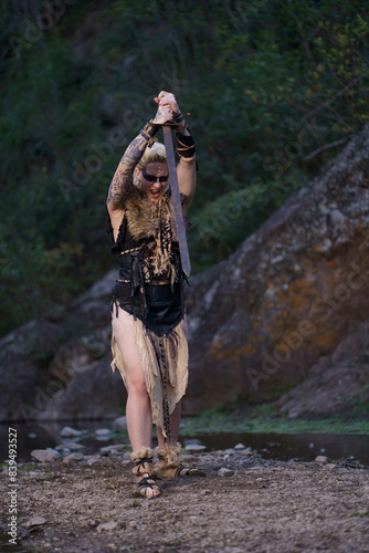 Viking warrior with sword, skull and battle bat