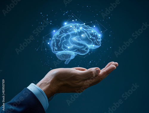 Wallpaper Mural A hand holding a brain with a blue background Torontodigital.ca