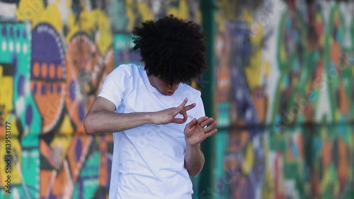 young man on the street dancing urban style photo