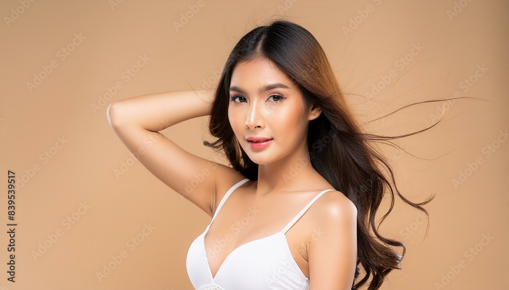 Young Asian woman with long hair and perfect skin, in white underwear and Korean makeup, in front of a colored background Young Asian woman with long hair and perfect skin, in white underwear and Korean makeup, in front of a colored background