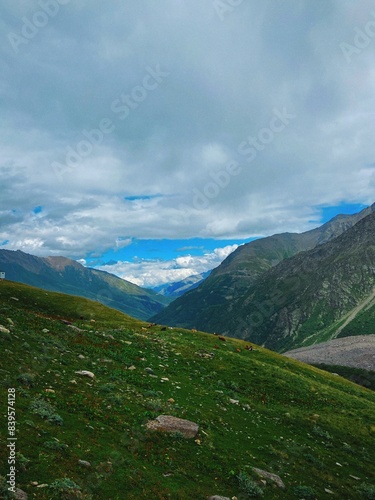Mountain ranges in the Elbrus region blue sky, white clouds, endless distances