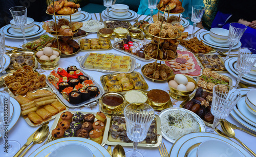 Moroccan Algerian breakfast table. Vintage background with different plates with delicious traditional middle eastern food