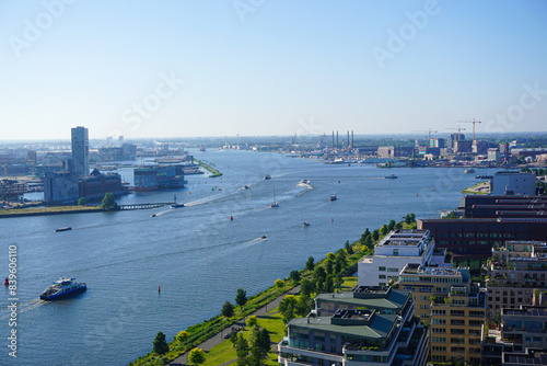 Canvas Print High angle view of buildings by river against clear sky