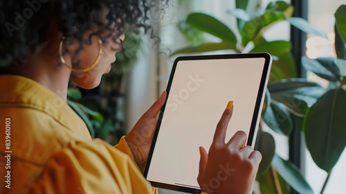 Close-up of a female hand tapping on a blank screen of an iPad made with Ai generative technology