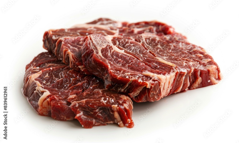 Obraz premium Succulent Raw Beef Steak with Intricate Marbling on White Background - Realistic High-Resolution Premium Freshness Close-Up