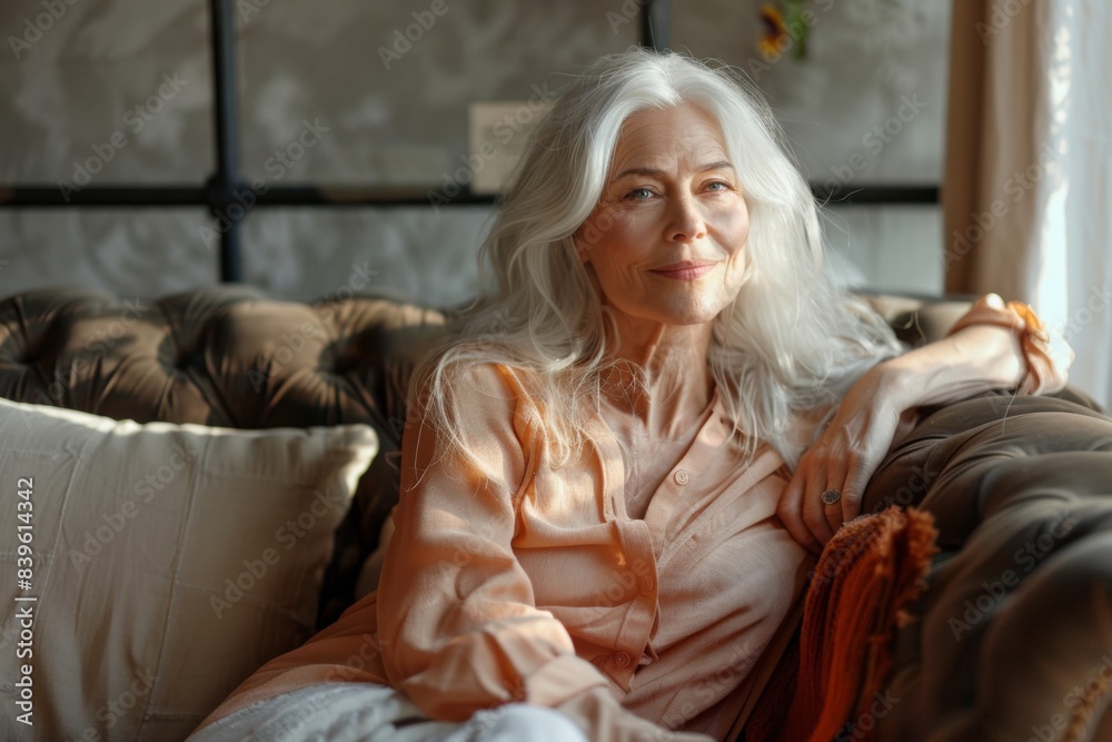 Woman on couch with remote control Woman on couch with remote control