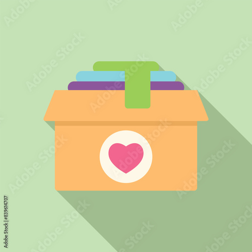 Packing a cardboard box full of clothes as a donation for those in need