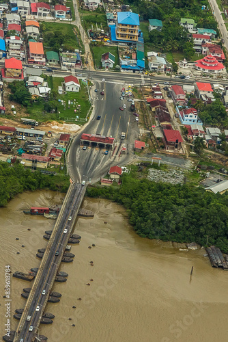 The world's longest movable vehicular pontoon bridge over the Demerara River in Georgetown, Guyana, South America. Aerial view. World tourism, attractions, landscape.