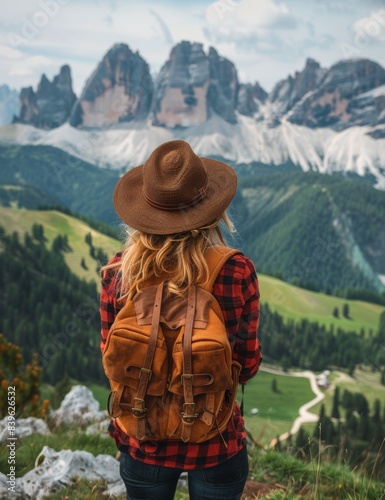 Woman Hiking With Backpack In Mountainous Landscape