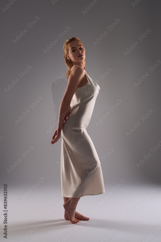 Young elegance woman in white dress in the darkness Young elegance woman in white dress in the darkness