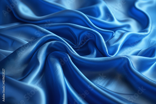 A close-up view of blue fabric with flowing, wavy patterns that resemble water or waves.