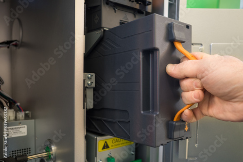 installation of the cassette in the deposit module of the terminal for cash payment and cash acceptance