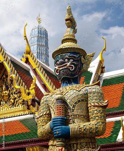 Statues of the demon guard at the entrance of the Wat Phra Kaew temple (Thailand, Bangkok), they are called Yaksha mythological creatures who protect the sacred places photo