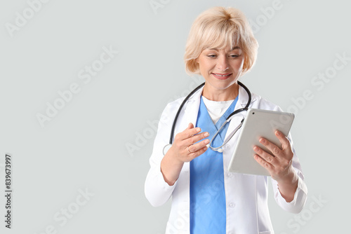 Female doctor with tablet c...