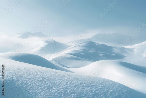 Snow covered mountains portrayed against a backdrop of blue sky