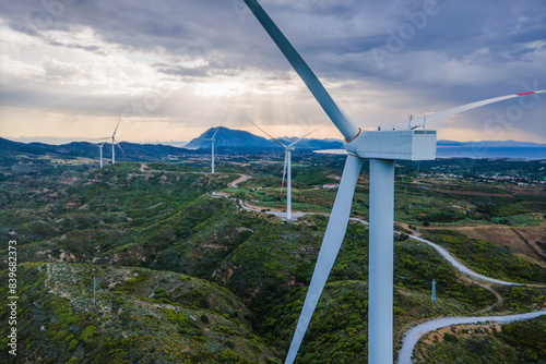 Windmill turbine green energy generating alternative power with zero emission. Aerial close-up view